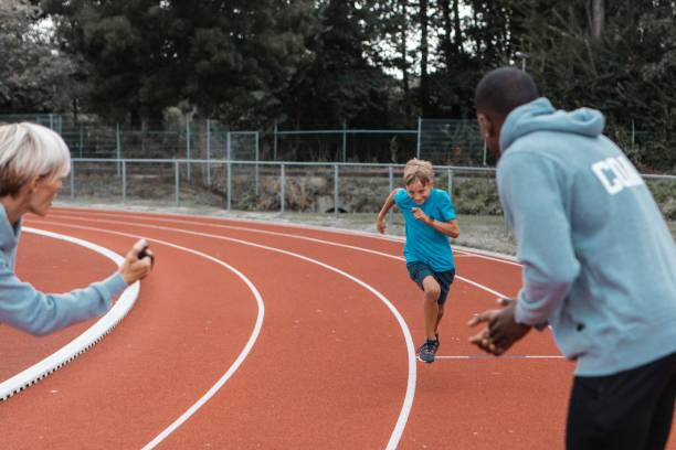 istock Athletics mother running coach working with her children during a training session 1422771045