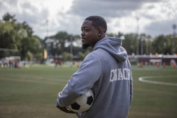 Handsome black soccer football coach