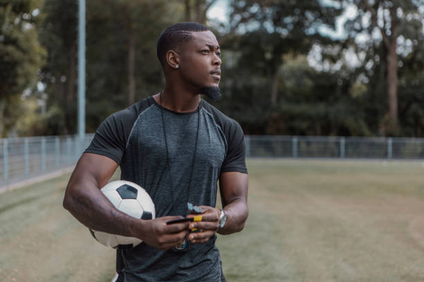 istock Handsome black soccer football coach 1422771669