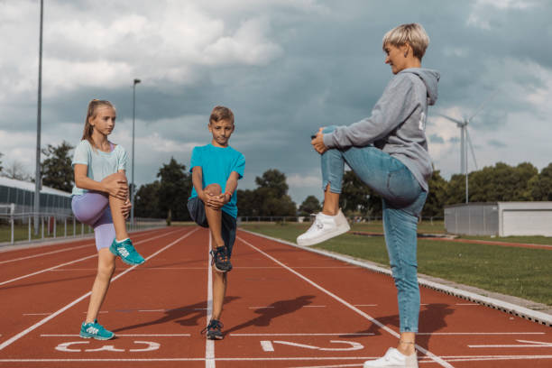 istock Athletics mother running coach with her children during a training session 1422771691