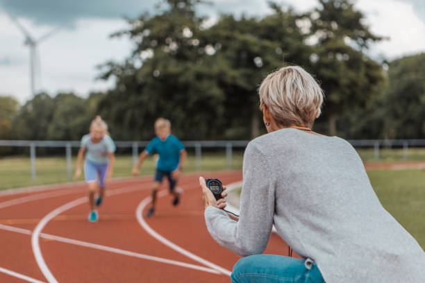 istock Athletics mother running coach with her children during a training session 1422771792
