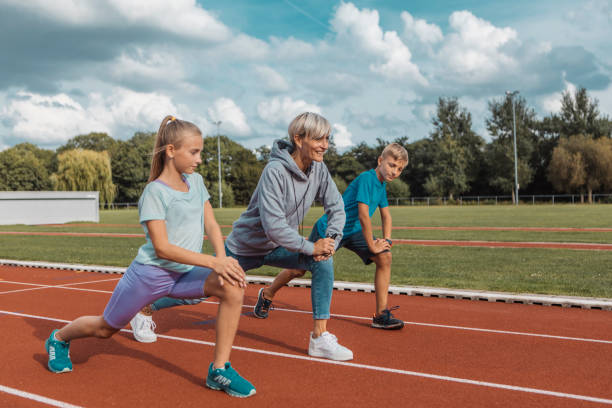 istock Athletics mother running coach with her children during a training session 1422771793