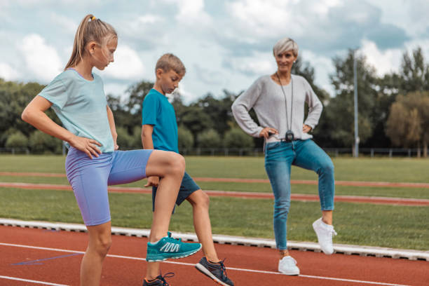 istock Athletics mother running coach with her children during a training session 1422771797