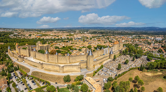 Carcassonne, France, August 24, 2022: Aerial top view of Carcassonne medieval city and fortress castle from above, Southern France. Carcassonne is a French fortified city in the department of Aude, in the region of Occitanie.