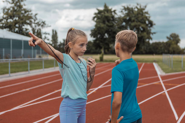 istock Athletics children running coaches at the track during a session 1422771980