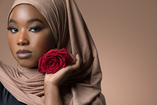Portrait of a Beautiful Muslim Woman wearing hijab in a studio shot