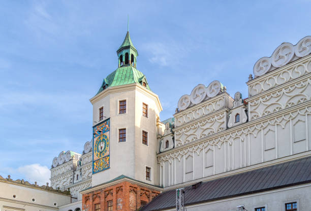 Szczecin, Poland - May 14, 2022: Beautiful view of ancient historical district of Szczecin. Medieval Pomeranian Dukes' Castle and a vintage clock on the tower wall