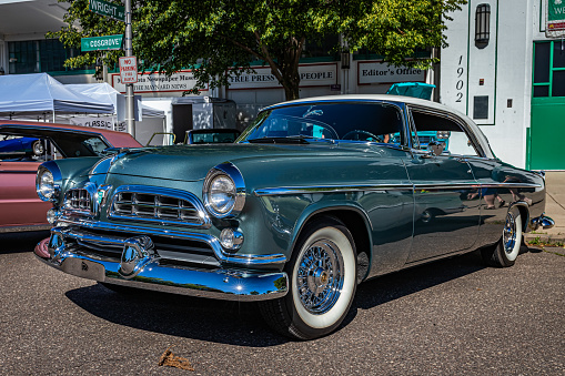 Falcon Heights, MN - June 17, 2022: Low perspective front corner view of a 1955 Chrysler Windsor Nassau Coupe at a local car show.