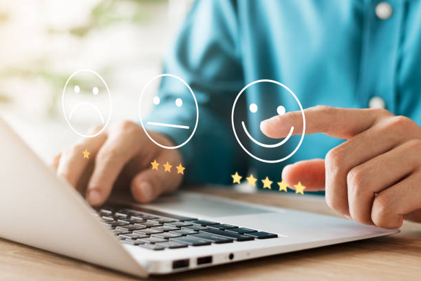 istock User give rating to service experience on online application, Customer review satisfaction feedback survey concept, Customer can evaluate quality of service leading to reputation ranking of business. 1422775215