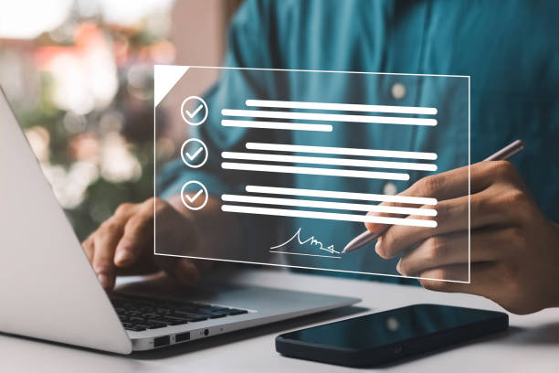 istock Electronic Signature Concept, Electronic Signing Businessman signs electronic documents on digital documents on virtual laptop screen using stylus pen. 1422775466