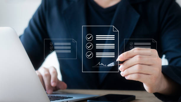 istock Electronic Signature Concept, Electronic Signing Businessman signs electronic documents on digital documents on virtual laptop screen. 1422776802