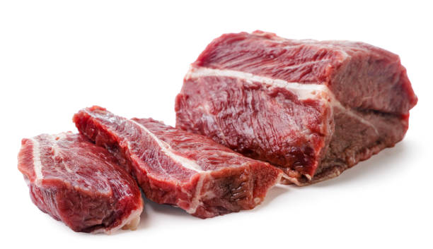 istock Raw beef meat cut into pieces close-up on a white background. Isolated 1422777277
