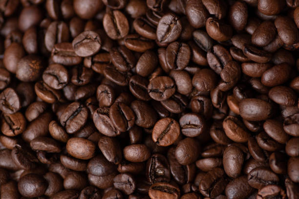 istock Roasted coffee beans background. Macro photo 1422780164