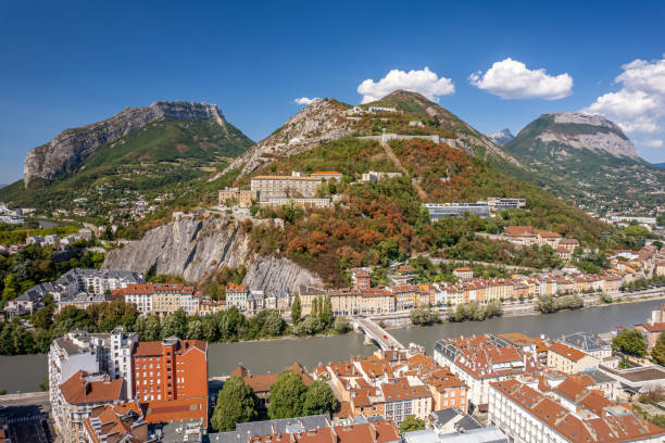 The drone panoramic aerial view of hill and fortress of the Bastille. The Bastille located at the south end of the Chartreuse mountain range and overlooking the city of Grenoble, France. isere river stock pictures, royalty-free photos & images