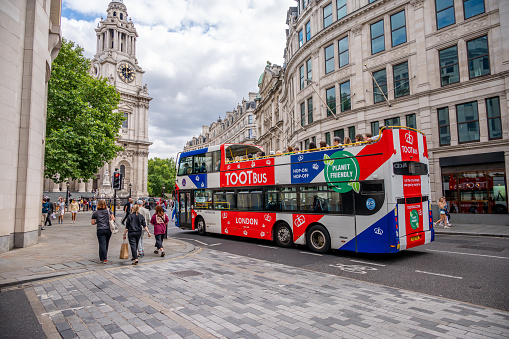 London, UK - August 21, 2022: Toot Bus, London touring bus outside St Pauls Cathedral in London.