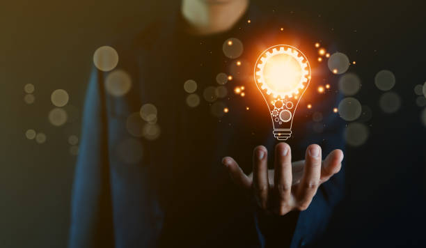 istock businessman holding a light bulb graphic Digital technology abstract. imagine an idea Creative and innovative. brain to brainstorm ideas in business. Strategies for development, growth, and success 1422782953