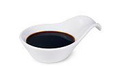 Soy sauce in bowl isolated on white background