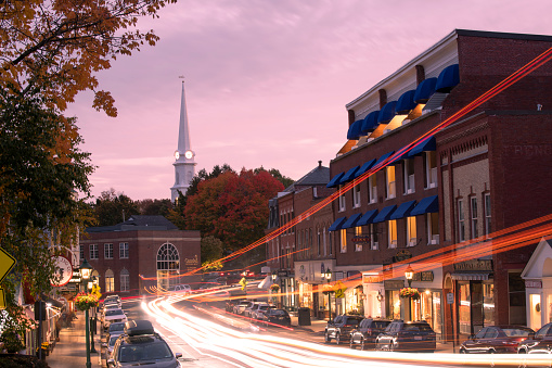 Camden, USA - October 13, 2021. Traffic on High Street in downtown Camden at dusk, Maine, USA