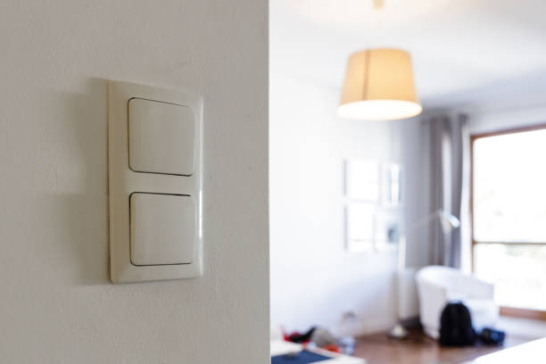 istock Wasting energy at home, lamp on during the day 1422785396