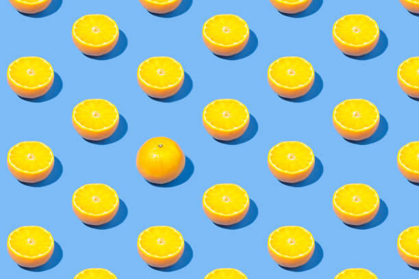 istock Summer pattern of yellow lemon slice on bright blue background. Minimal summer concept. 1422790836