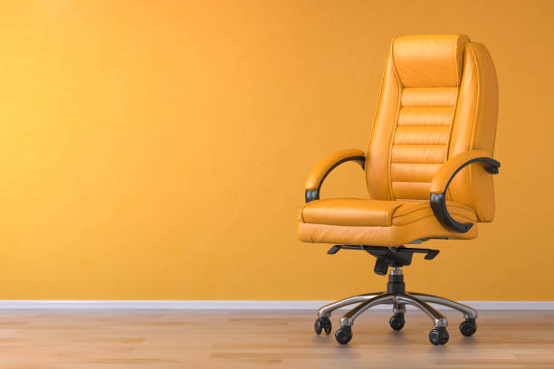 Yellow office chair in yellow interior with space for text. stock photo