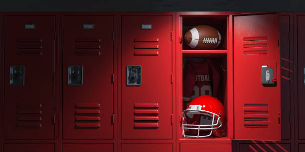 American football locker room with equipment, ball and helmet. stock photo