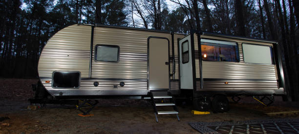 istock TRavel trailer after dusk in a forest 1422793964