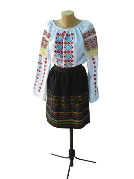 Photo of Balkanic traditional national folk woman costume isolated over white