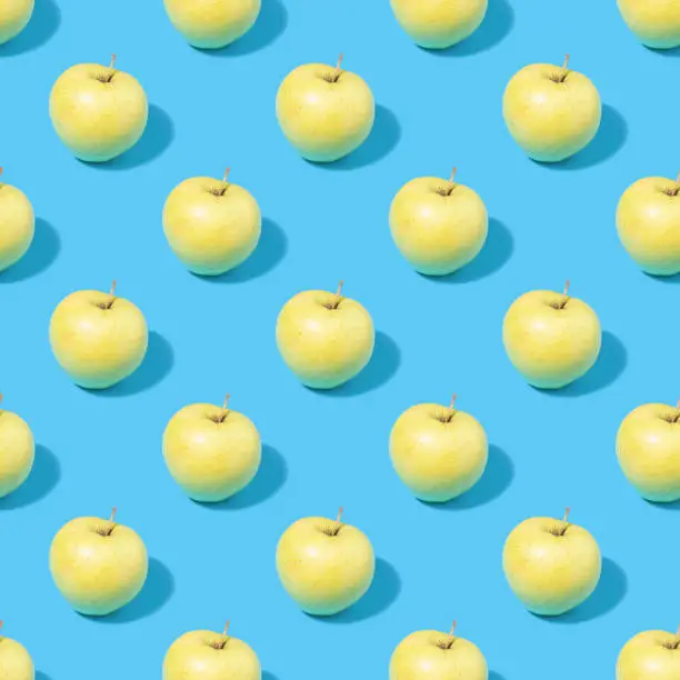 Seamless summer background with green apples - absolutely seamless pattern of green apples on a blue background