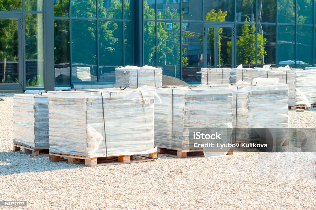 Timber Blocks Wrapped Bricks Or Paving Slabs Stacked On Pallets And Wrapped In Plastic Wrap ...
