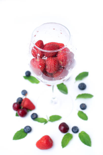 Strawberries in a glass with berries.