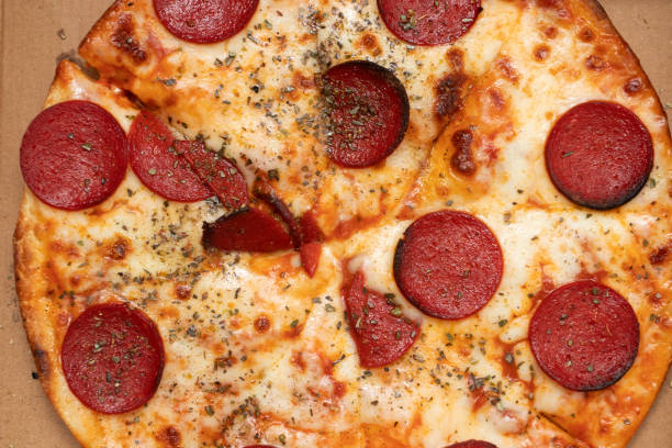 istock Closeup of Pepperoni pizza background 1422800403