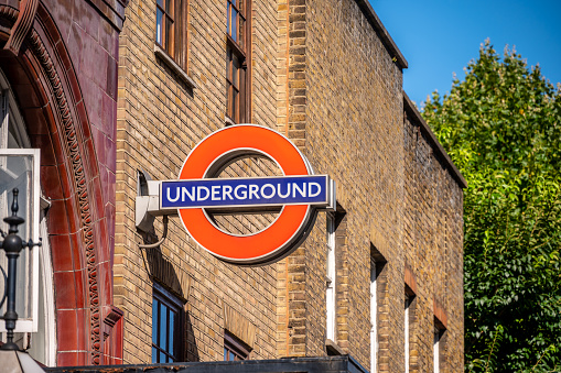 London, UK - August 22, 2022: Station name sign on the platform of Goodge Street underground station. London Underground is the oldest underground railway in the world.