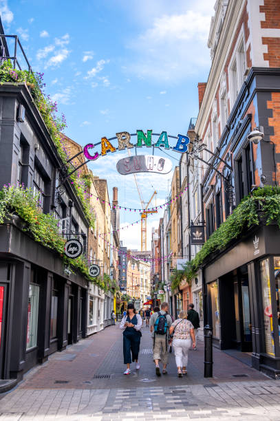 London, UK - August 23, 2022: Carnaby street London, a famous shopping street in Soho, in Summer.