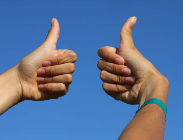 istock hands with thumbs up sign that everything is fine ok 1422803262