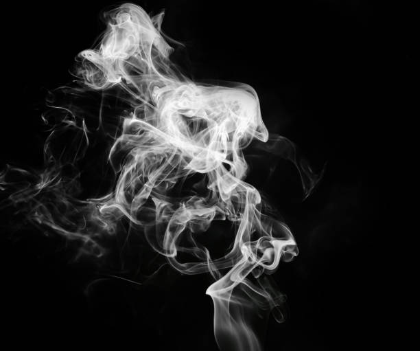 istock abstract fragment movement of white smoke on black background. 1422804169