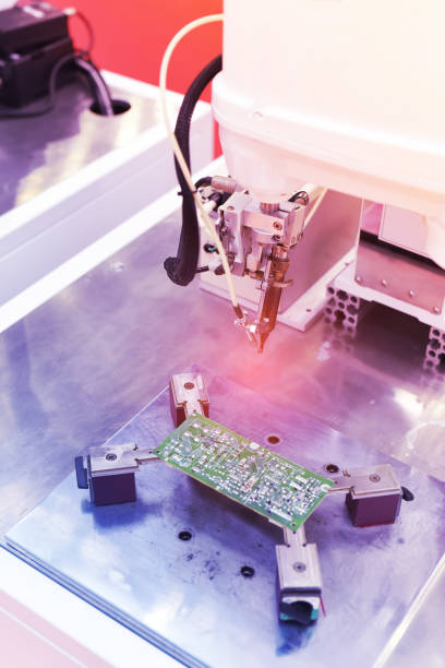 istock automatic robot for print circuit board (PCB)assembly machine during soldering or welding part 1422804620