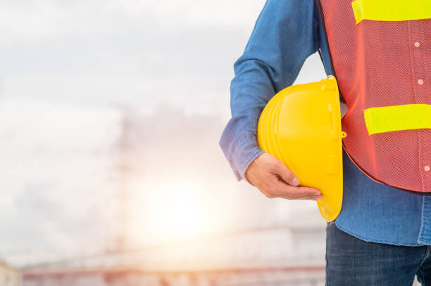 istock Engineer holding hard hat construction worker professional safety work industry building person manager service 1422806616