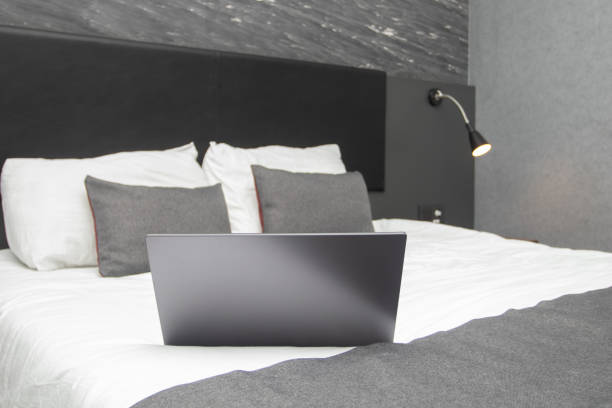 istock Laptop on the bed in the room 1422806687