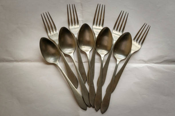 istock Five forks and five spoons arranged on a white paper tablecloth 1422807048