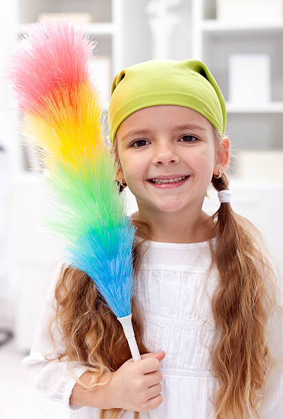 istock Little girl with dusting brush 142280941
