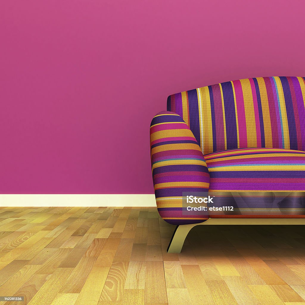 Room with multicolored couch, pink wall, and wood floors A contemporary colorful sofa Apartment Stock Photo