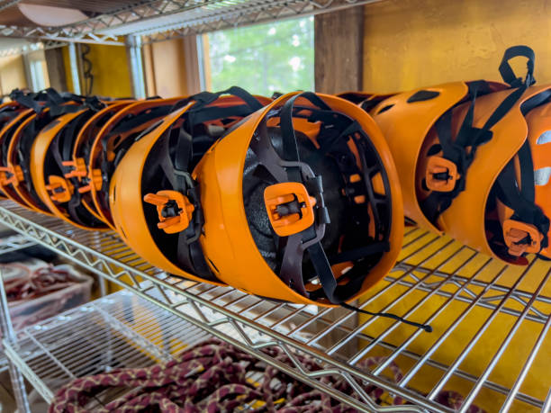 istock Row of helmets ready for use at a high ropes and climbing course. 1422814299
