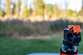 Aerosol trigger of a can of bear spray in an outdoor setting