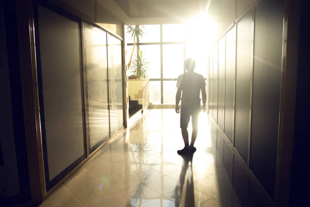 istock man goes to the window. 1422814525