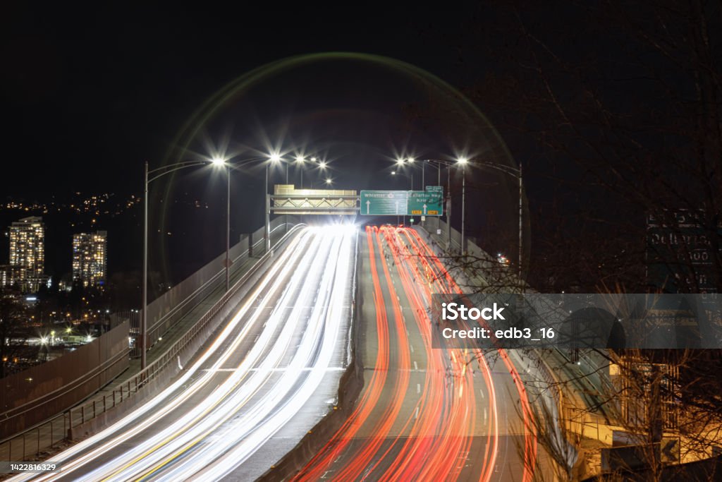 Traffic Going over the Second Narrows Bridge on Highway 1 Traffic Going over the Second Narrows Bridge on Highway 1 during night time. Vancouver, British Columbia, Canada. BC Stock Photo