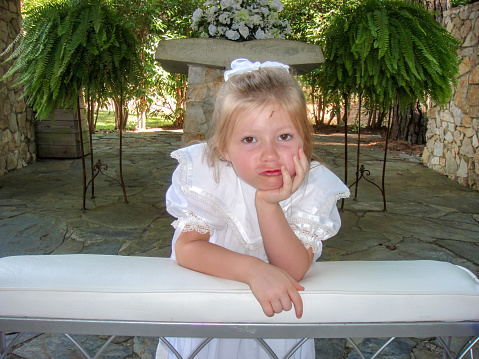 Flower girl in an outdoor wedding by the lake, October, Lake Martin, Alabama