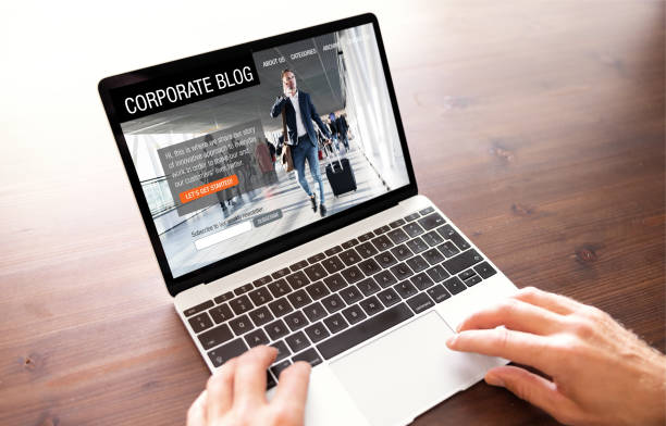 istock Man working on corporate blog website on laptop computer 1422817869