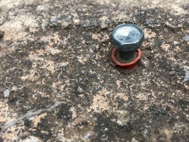 istock plastic plug with hex head screw anchored to a concrete wall 1422817917
