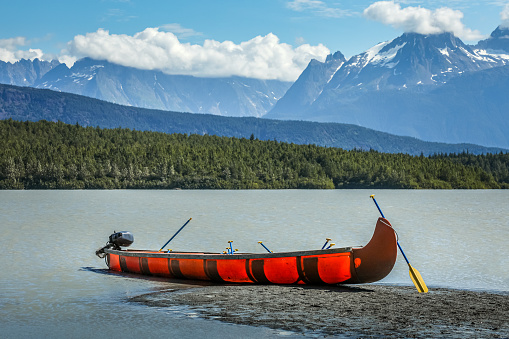 Photo of a man fly fishing and canoeing on Lake Dillon in Summit County, Colorado.